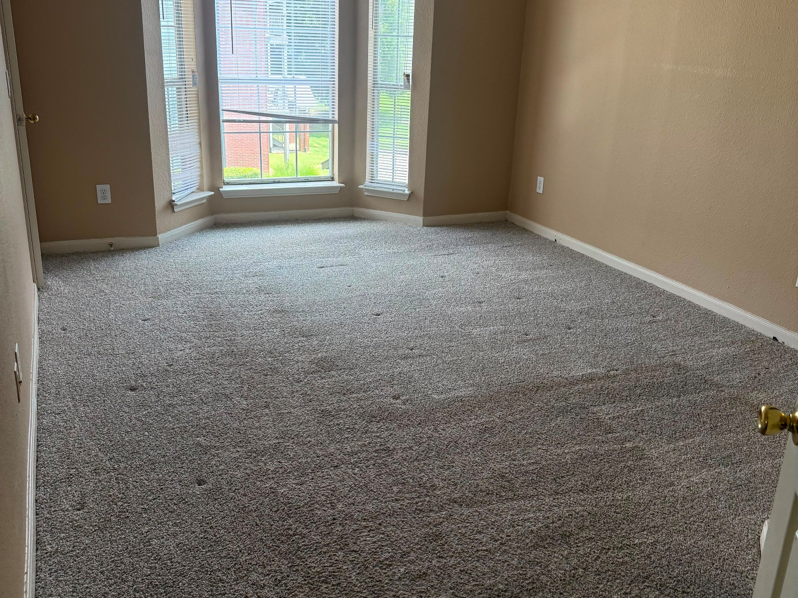 Freshly vacuumed bedroom carpet after cleaning