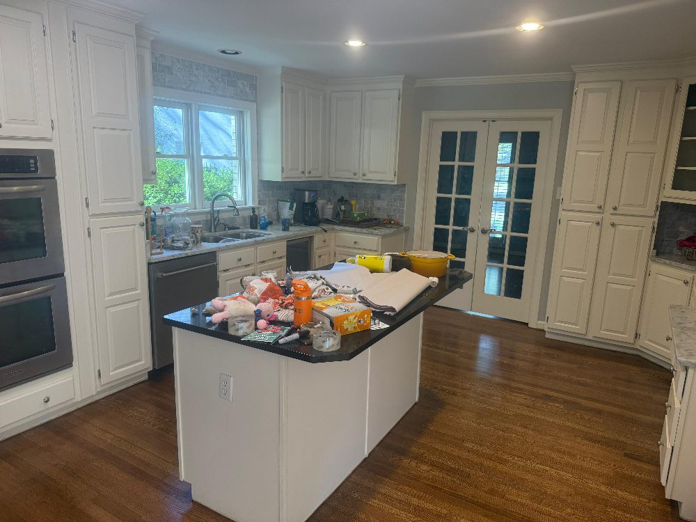 Cluttered kitchen before cleaning