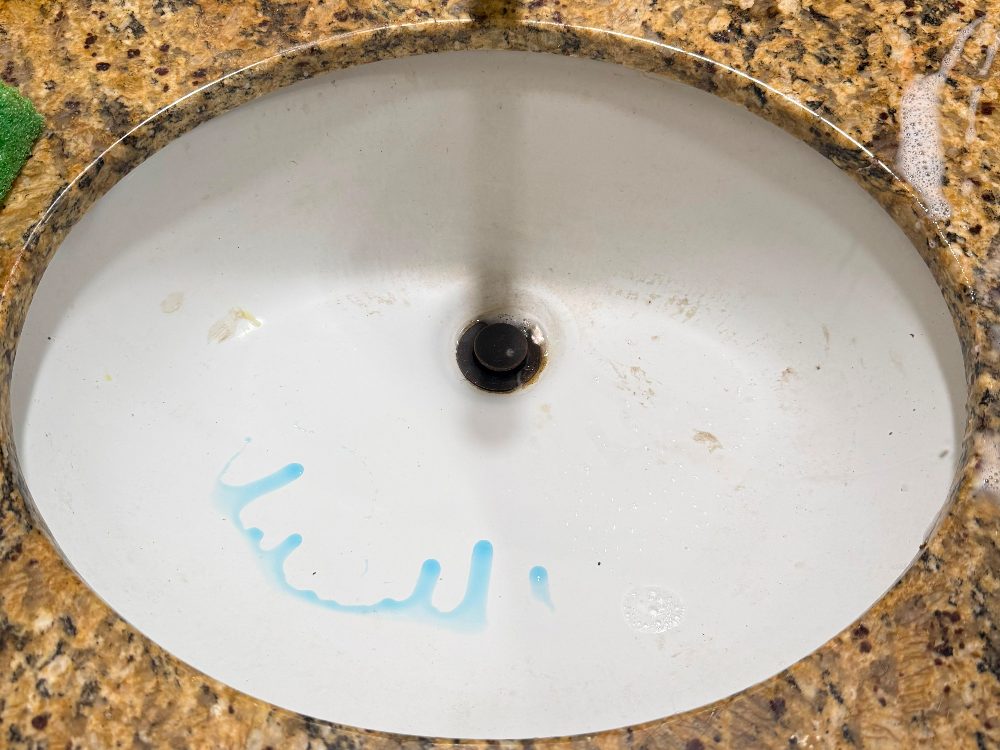 Bathroom vanity sink before cleaning